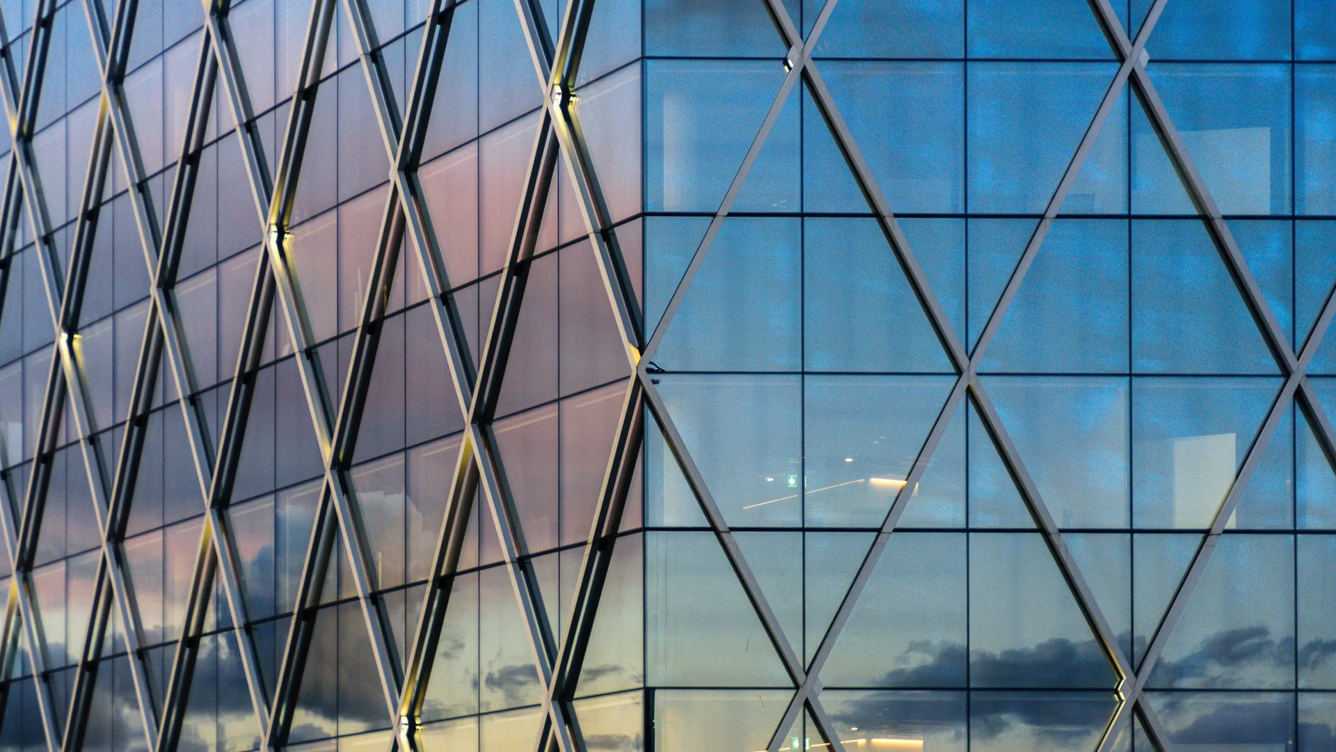 Geometric glass architecture representing structured technology leadership