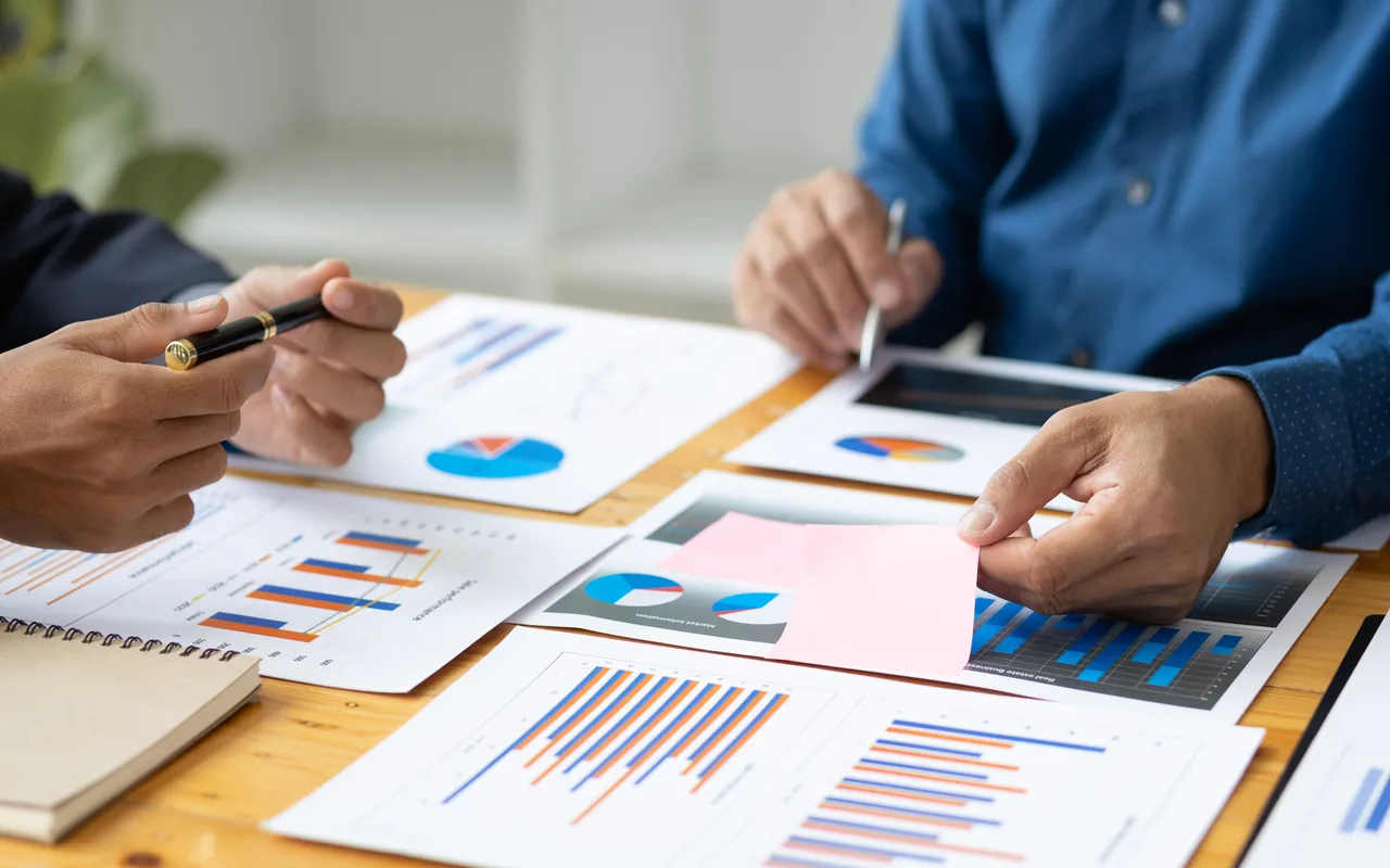 Charts and analysis being reviewed during an executive technology discussion