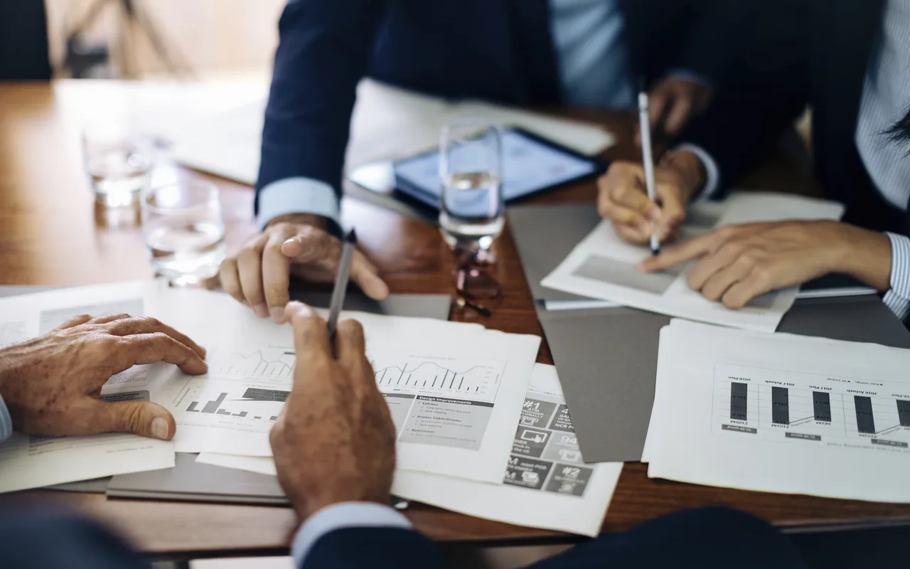 Business documents being reviewed during an advisory discussion